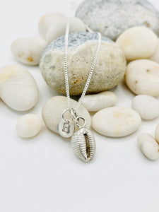 Solid Silver Cowrie Shell necklace.