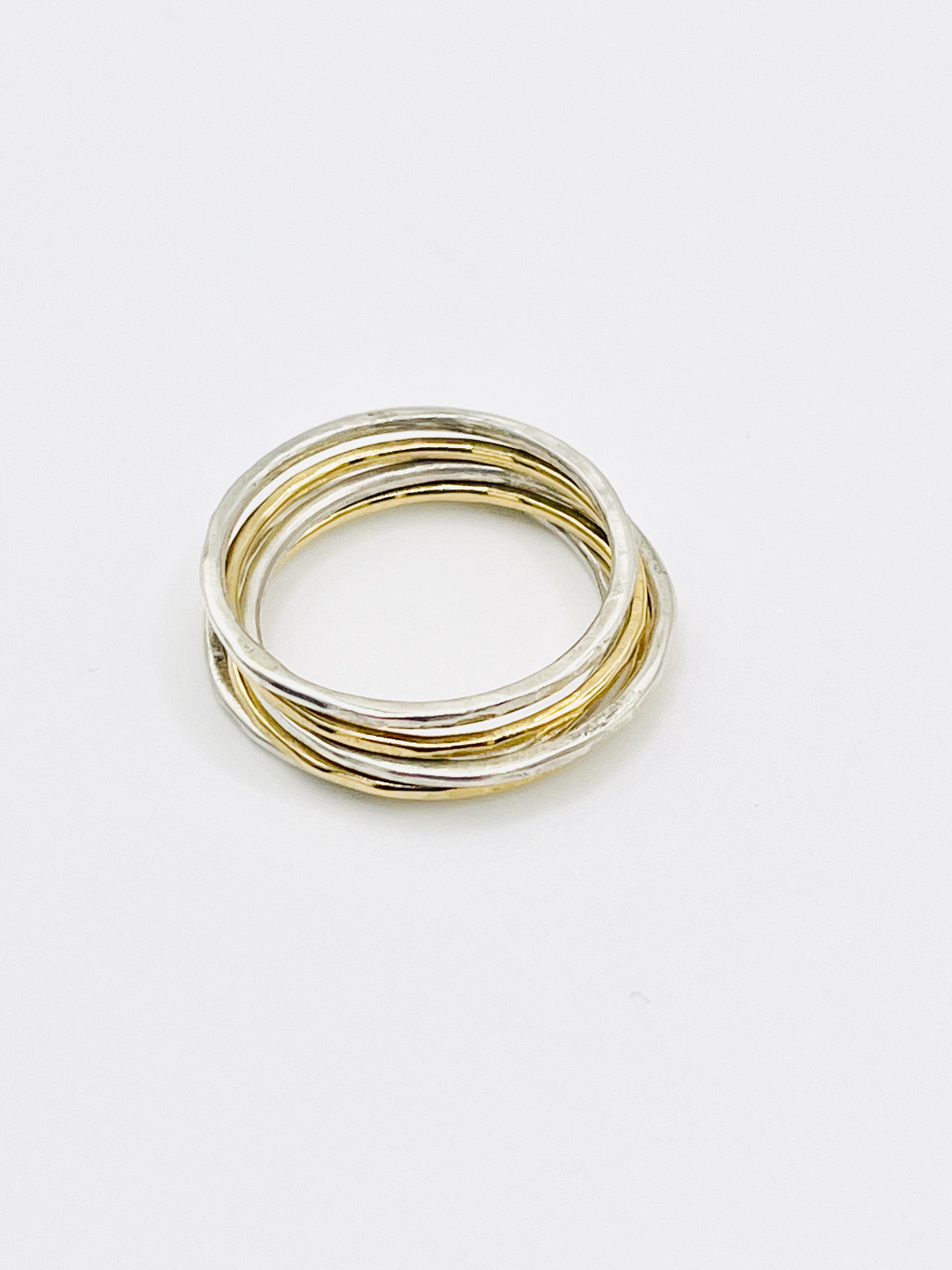 Silver and gold stacking rings.