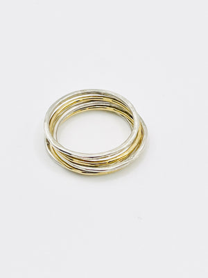 Silver and gold stacking rings.