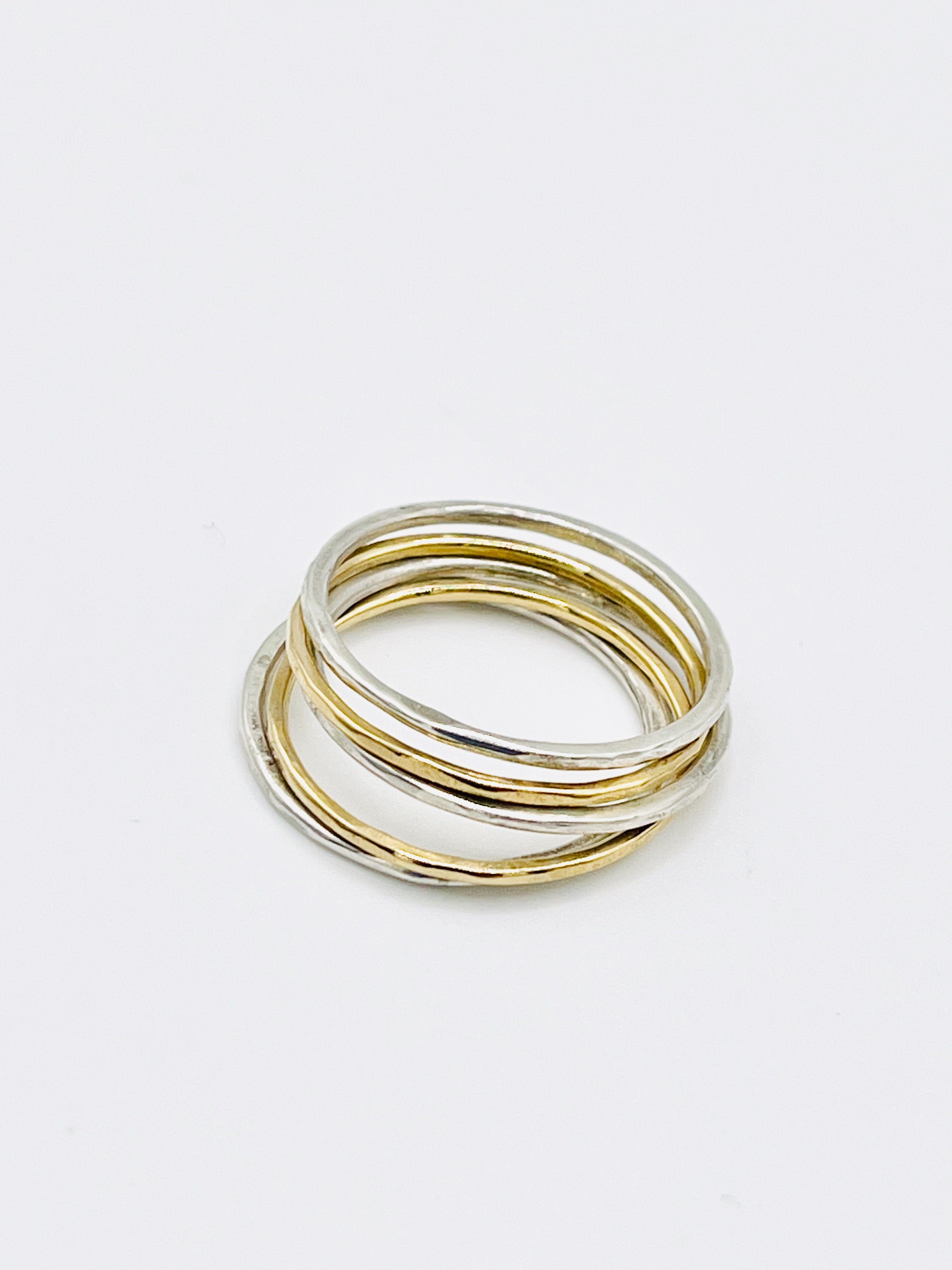 Silver and gold stacking rings.