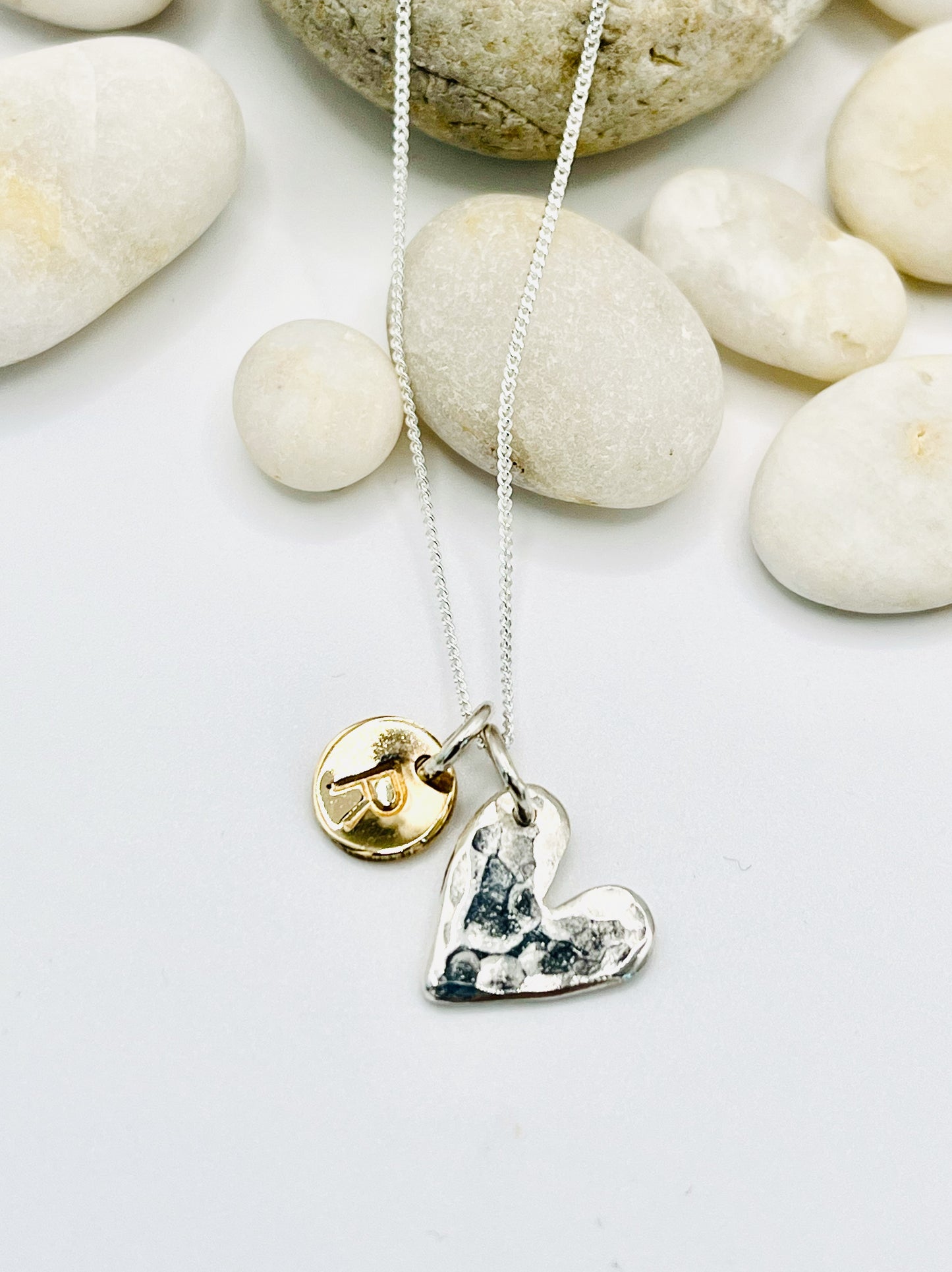 Silver personalised heart necklace.