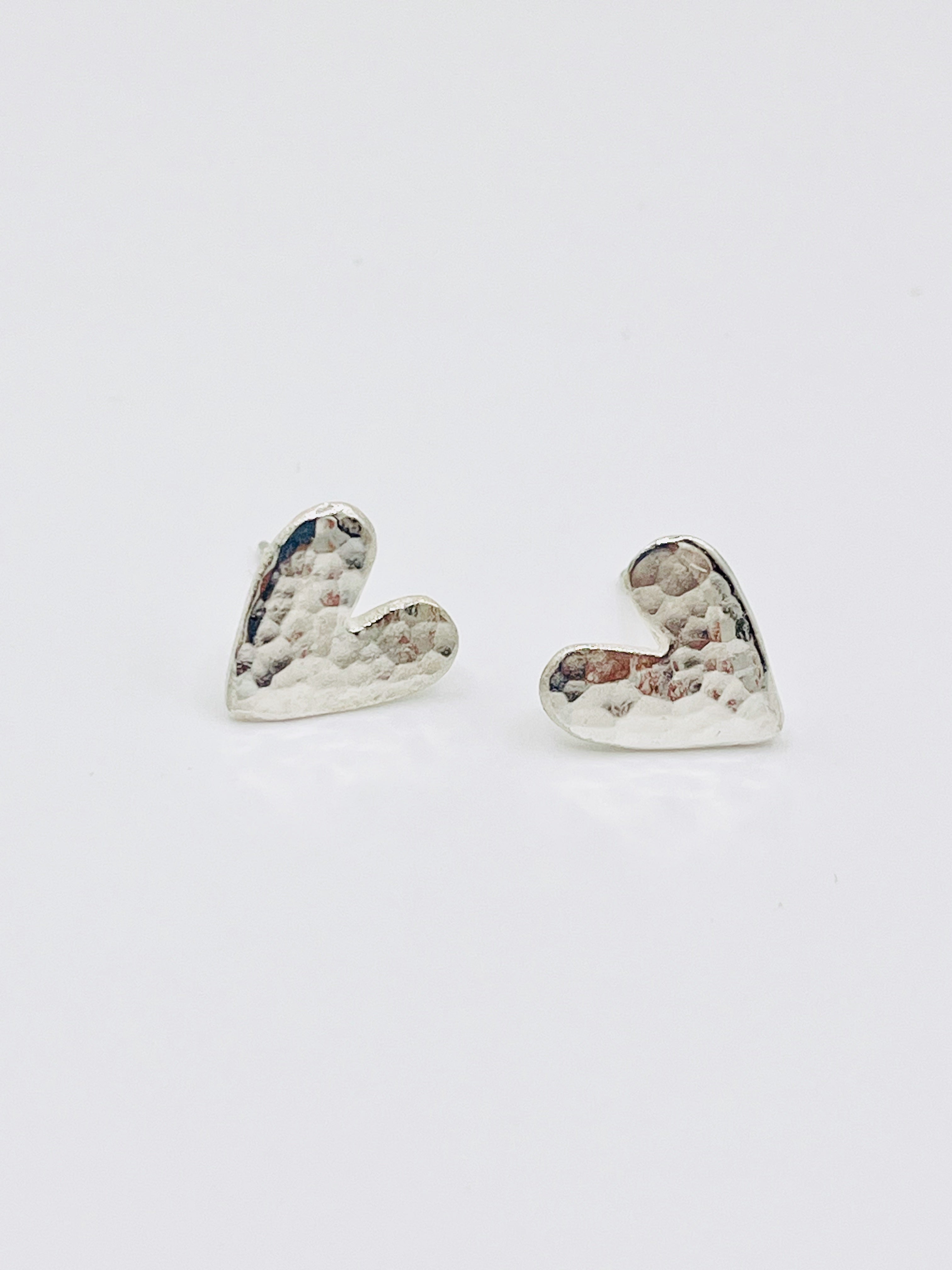 Silver heart studs.