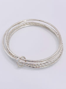 Multi textured Silver bangle.