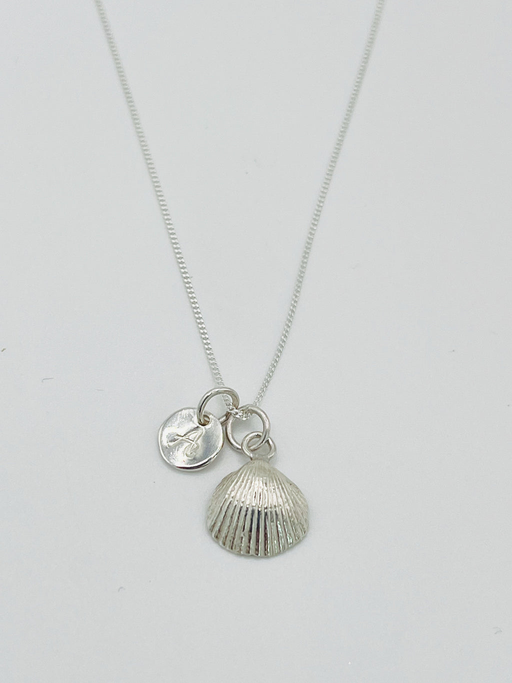 A personalised scallop necklace.