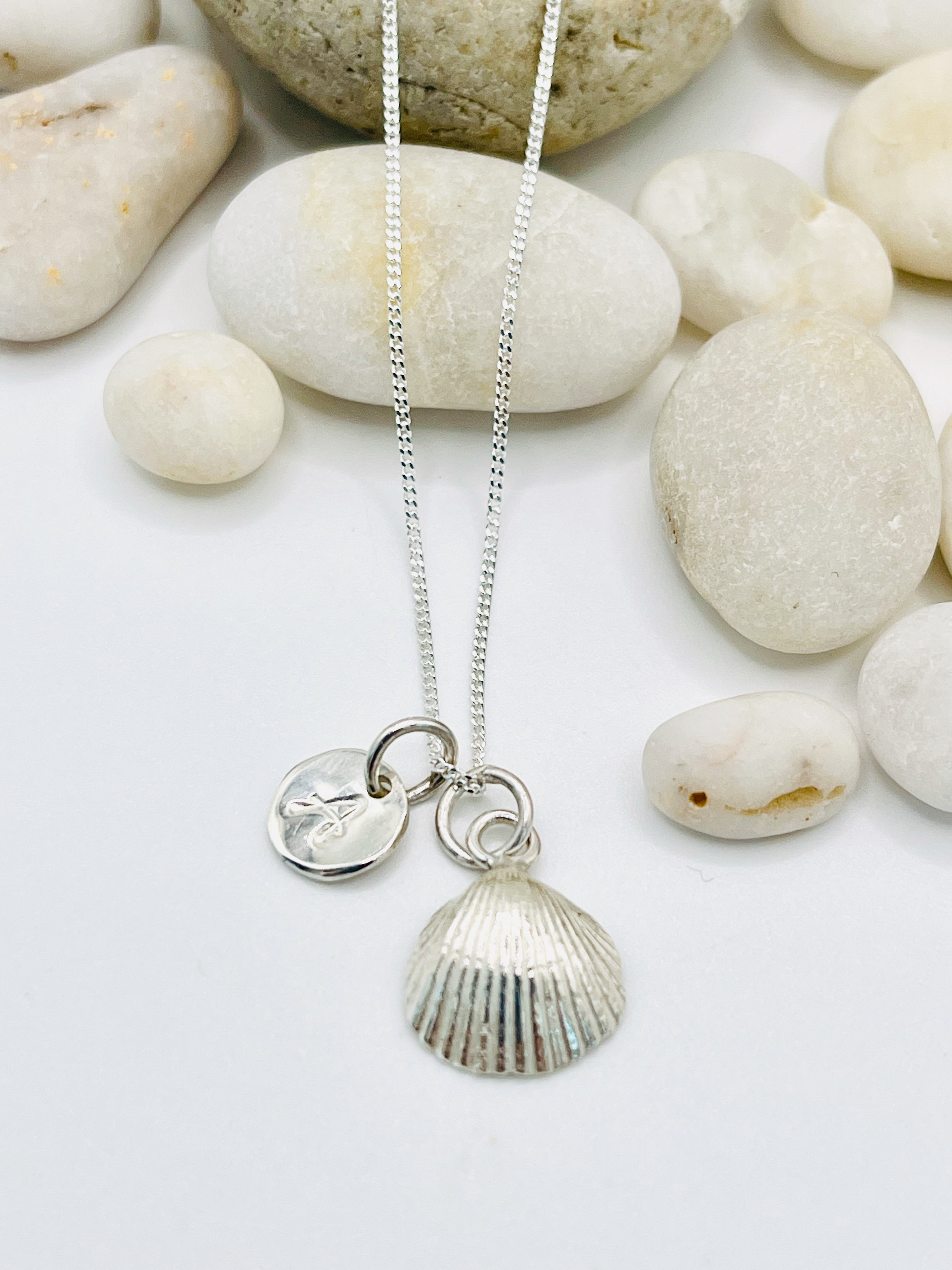 Silver personalised scallop shell necklace.