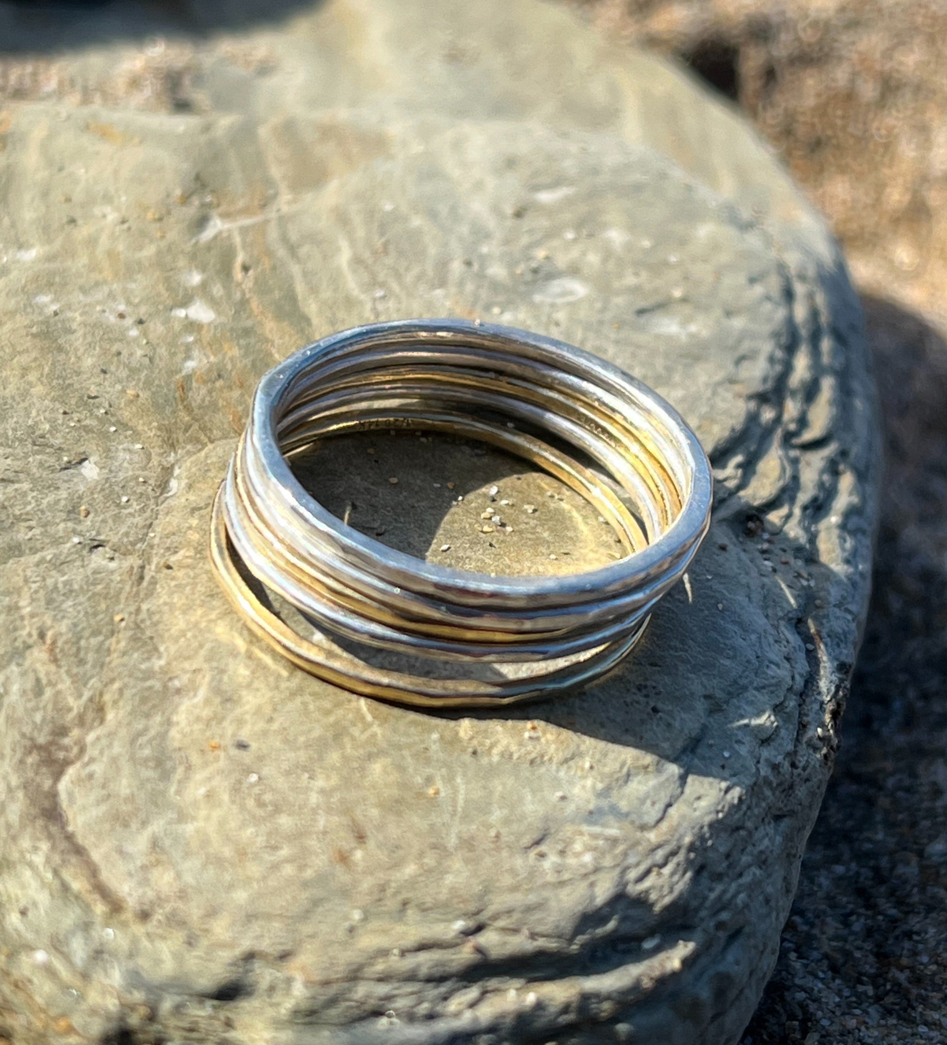 Silver and gold stacking rings.