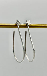 Silver star hoops.